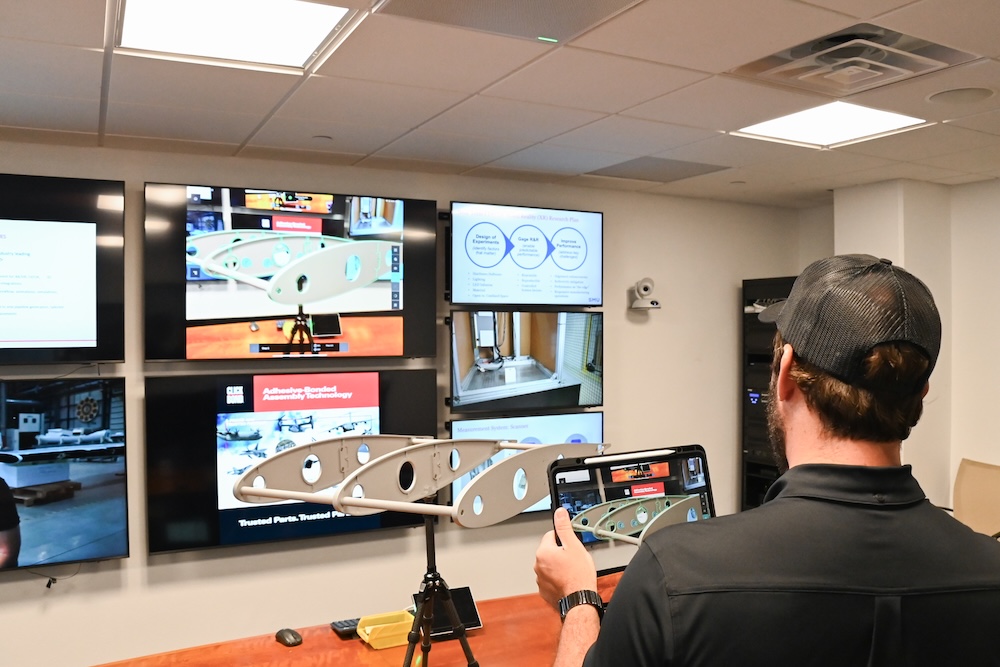 A student uses the digital twin augmented reality tools in the Center for Digital and Human Augmented Manufacturing.