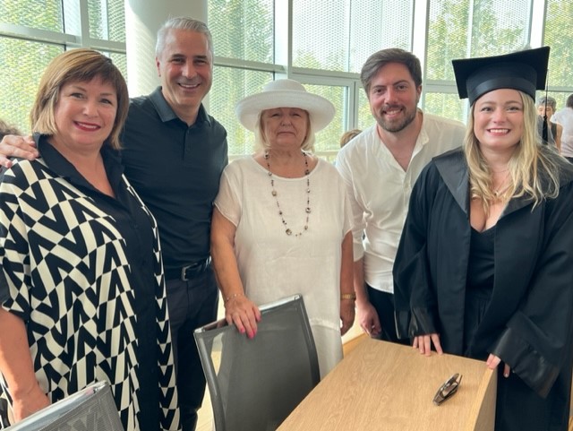 graduate with family