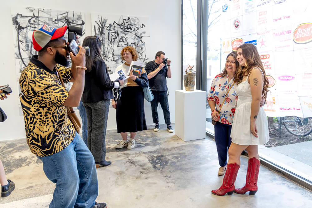 students at art exhibit