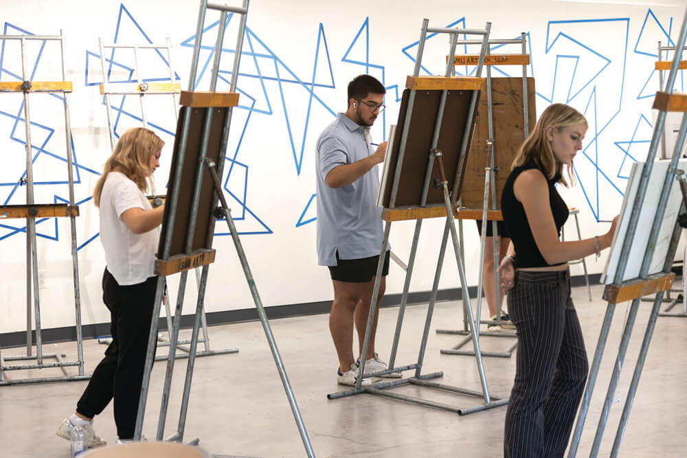 art class students work at easel