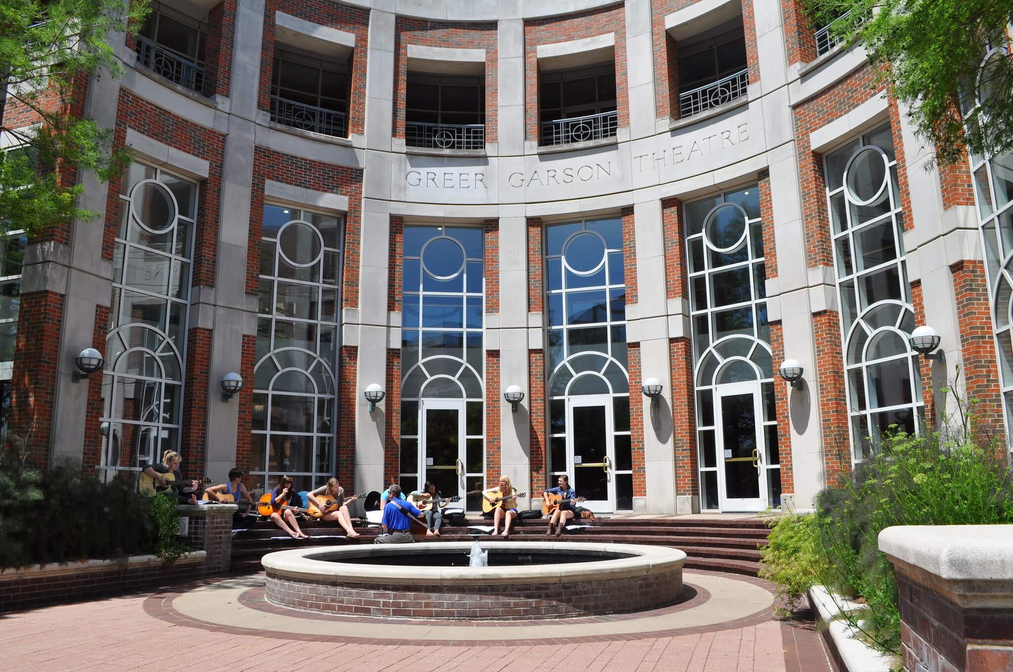 Greer Garson Front with students playing guitar