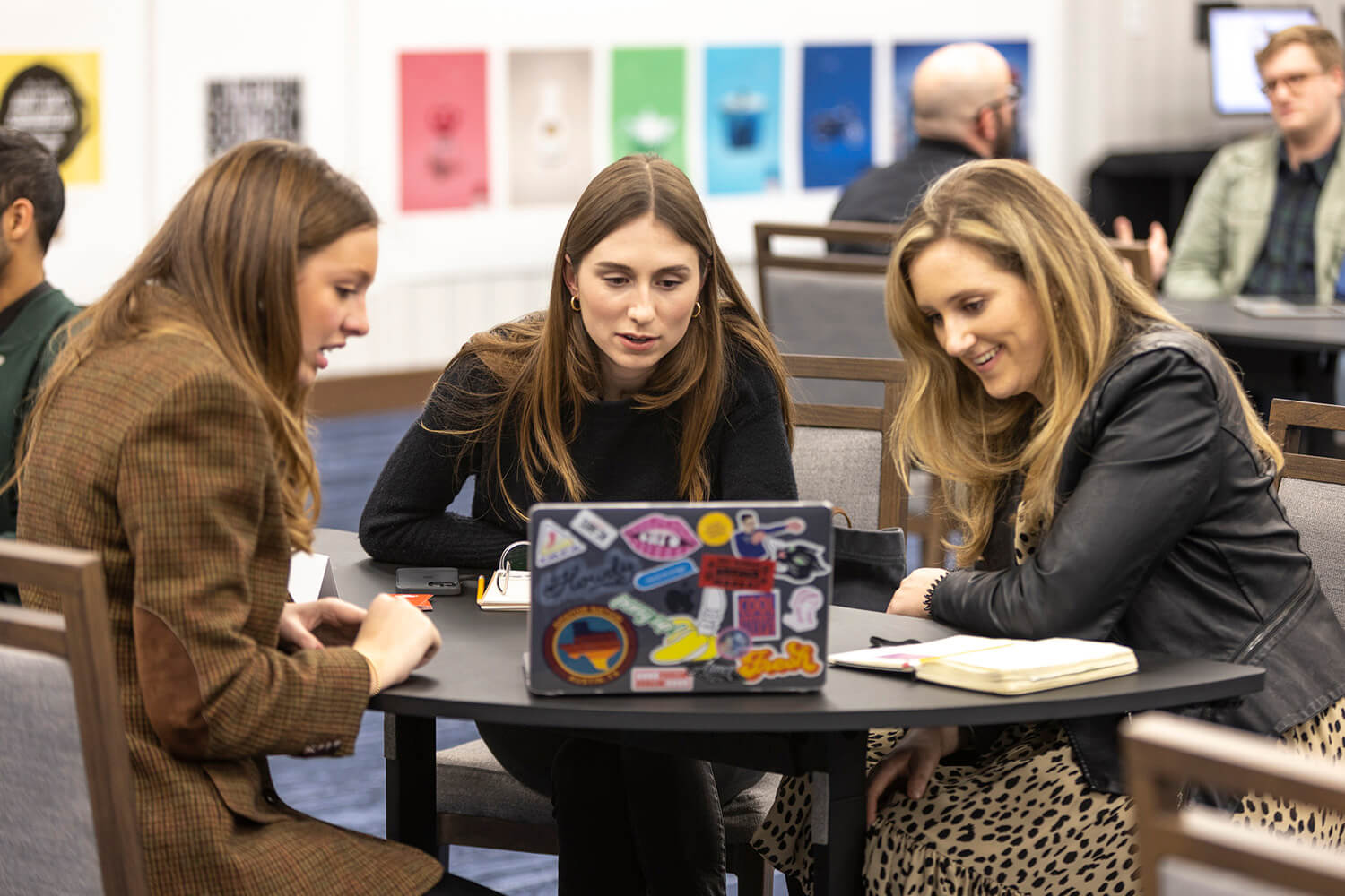 advertising-Female-students-around-computer