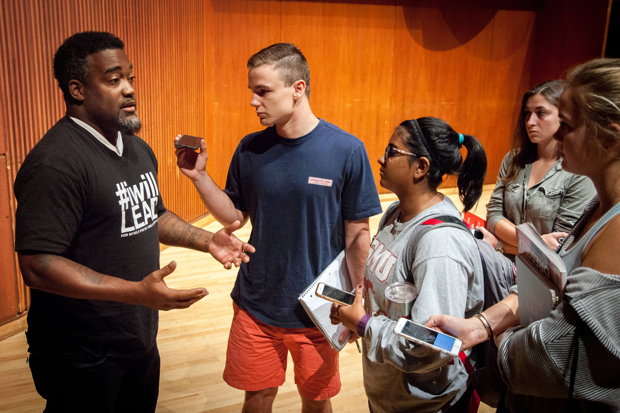 journalism students interviewing a man