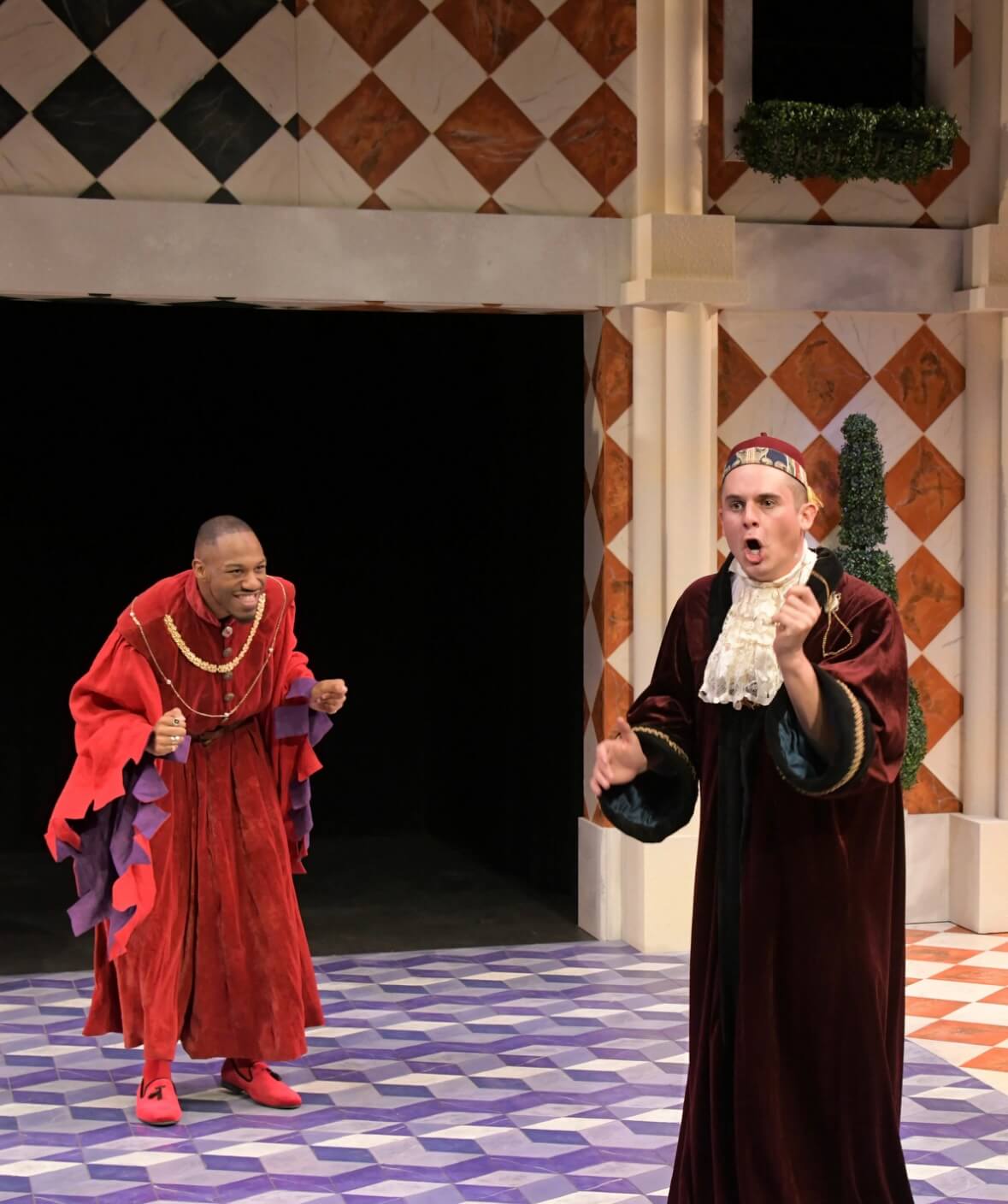 Sage Floyd on stage in red costume