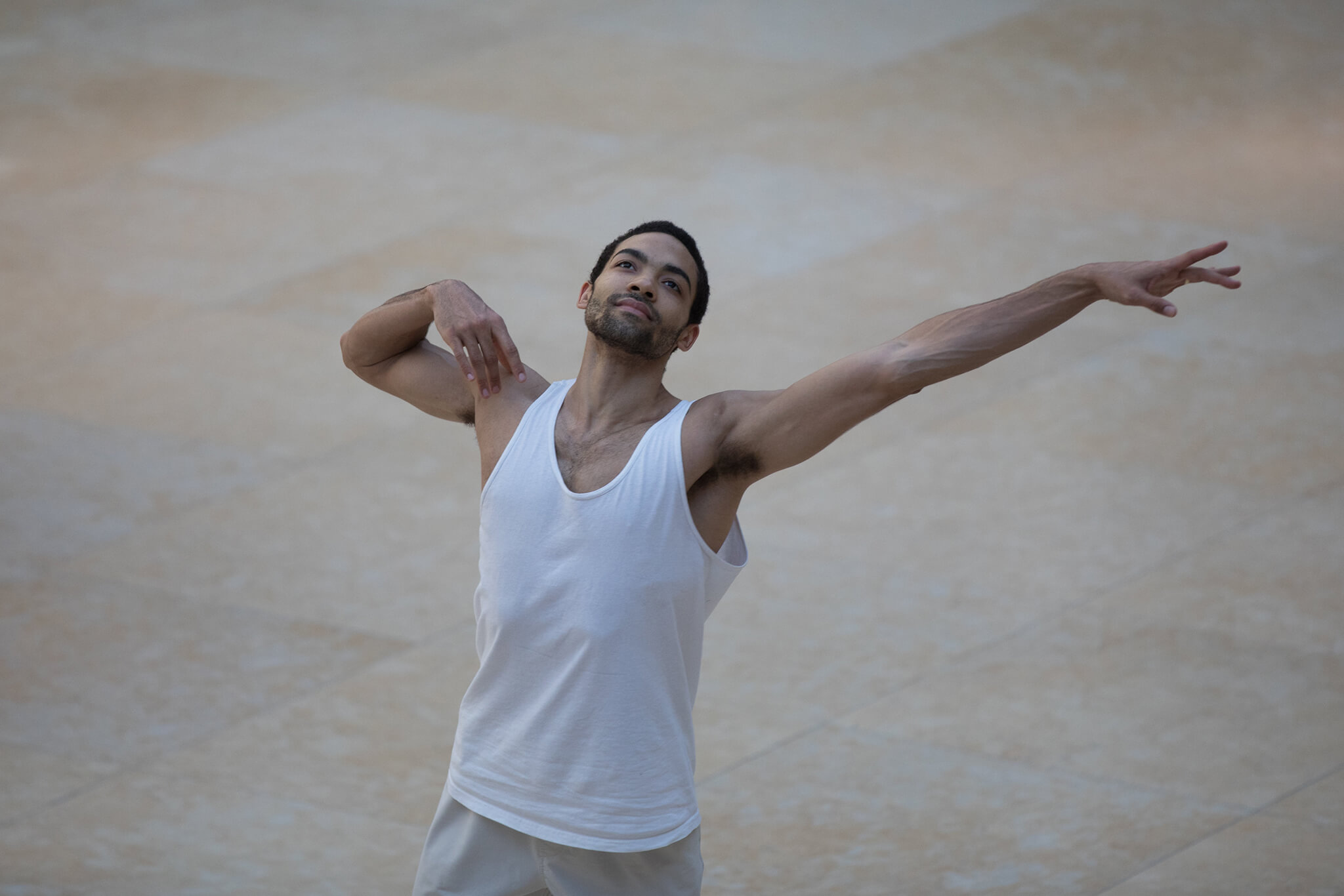 SilasFarleyInSongsFromTheSpirit - Dancer in white tank top