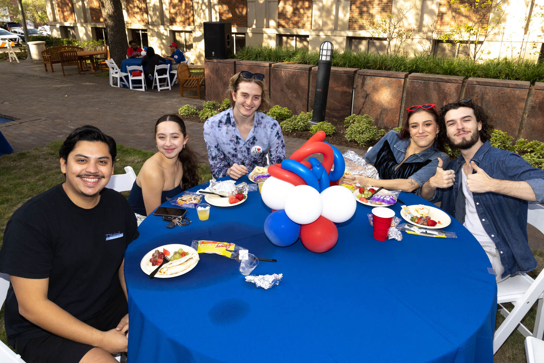 SMU Homecoming group of students around a table