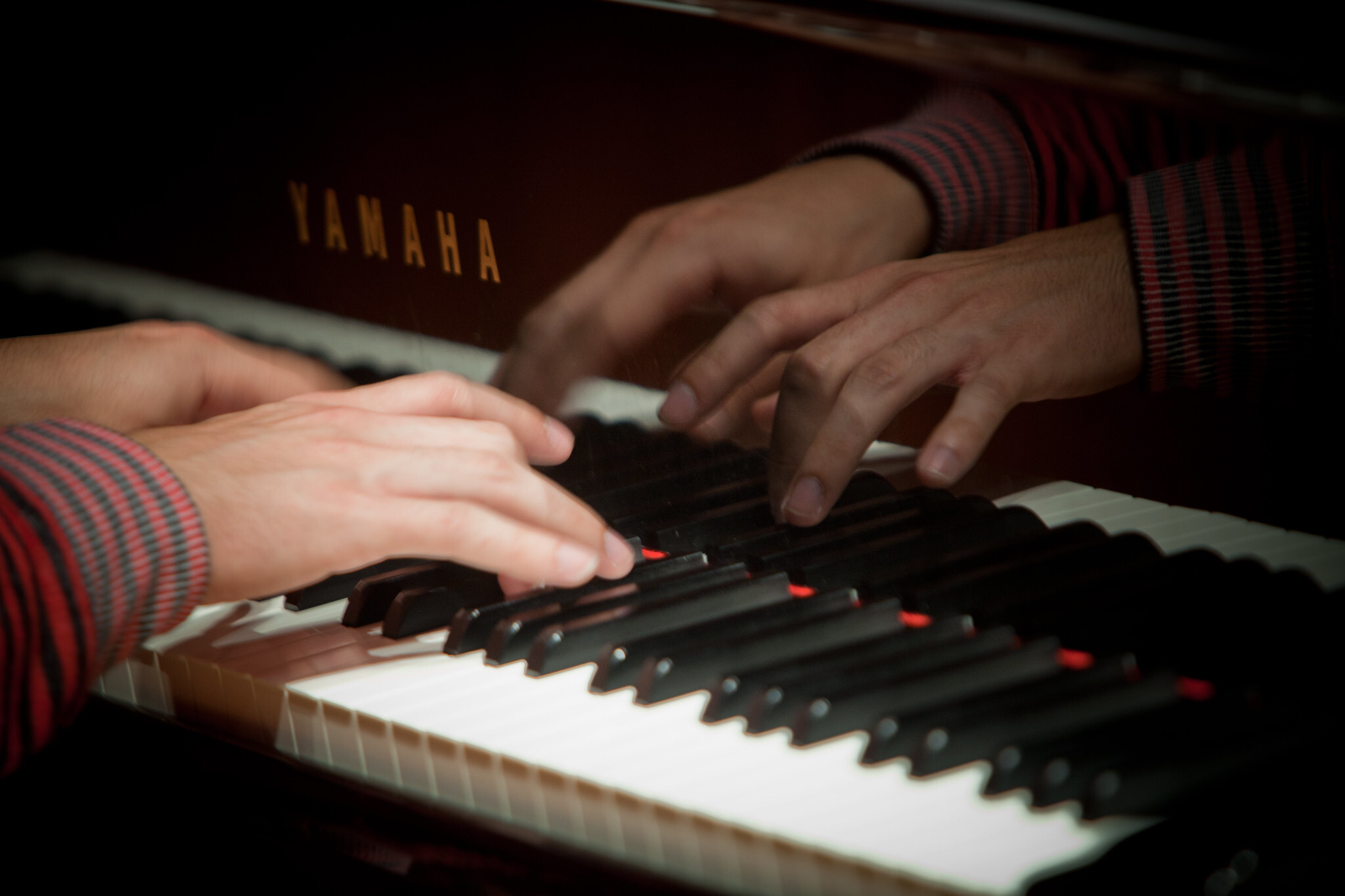 Student playing piano.