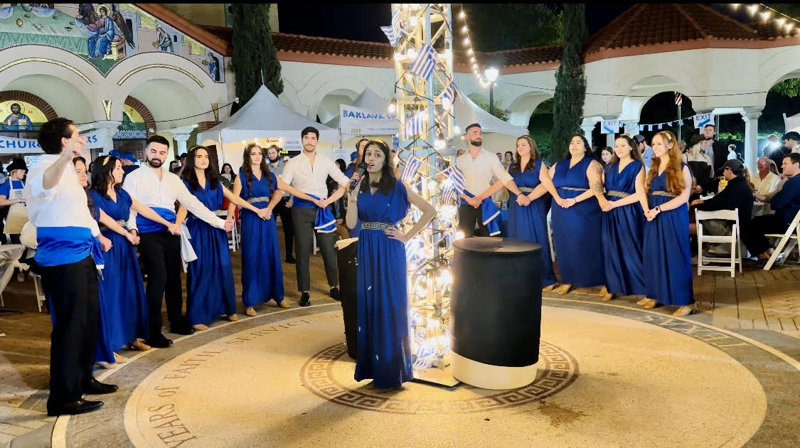 Art history alum Elise Huff (B.A. '20) poses in an art gallery.