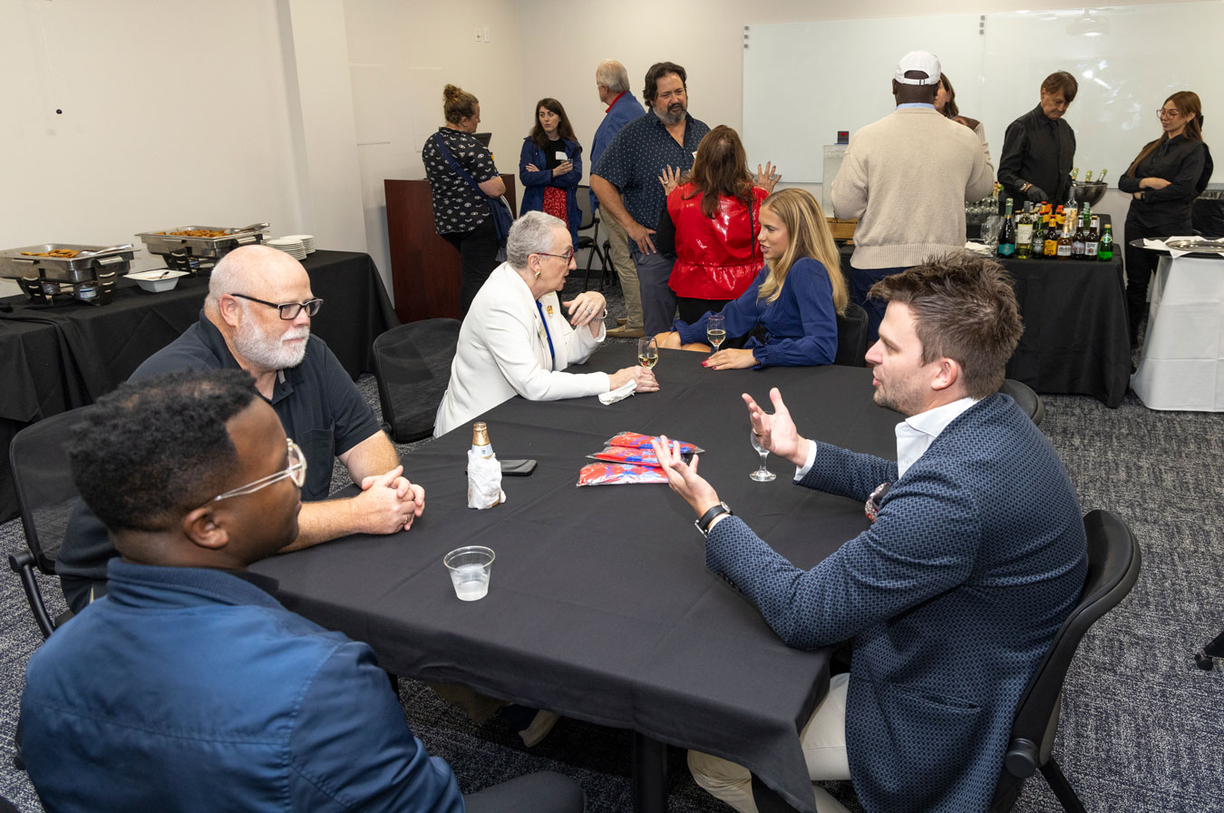 students and parents meet around a table