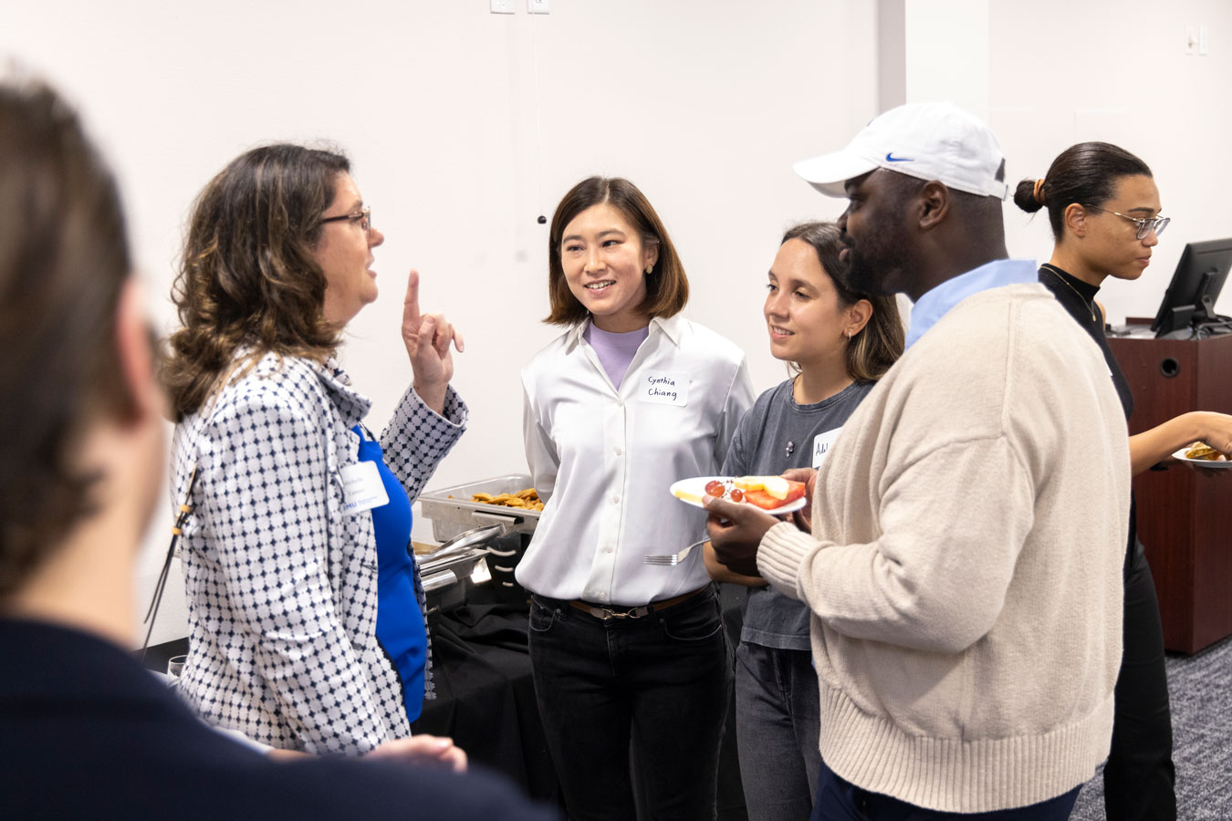students and faculty talking
