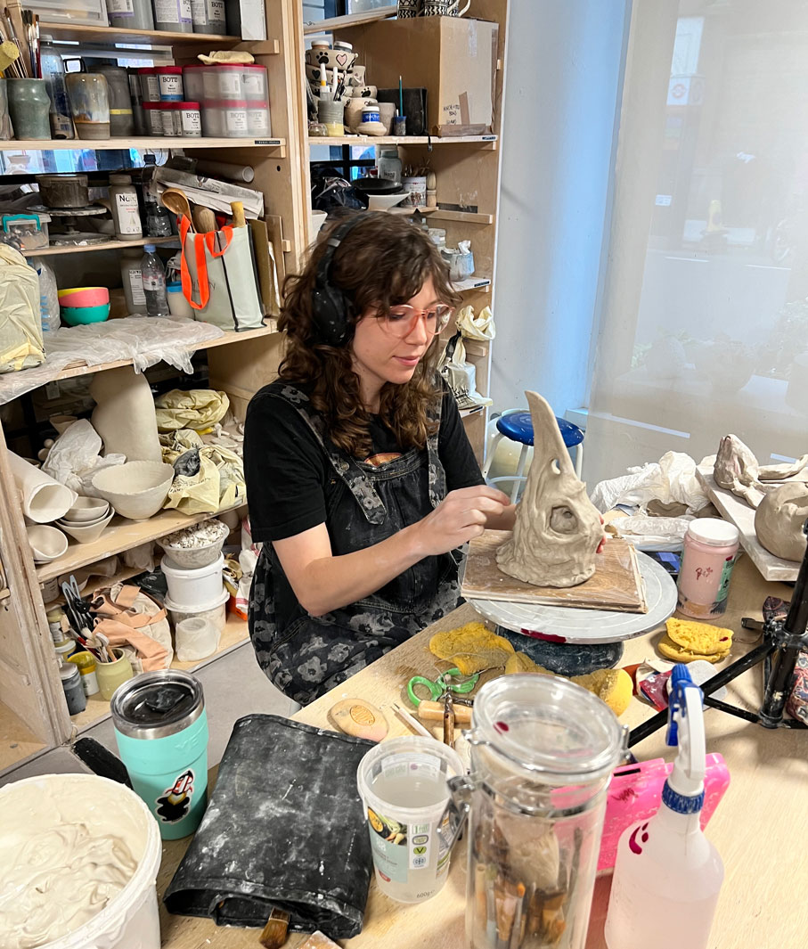Art alum Beth Greenleaf works on ceramics in her studio