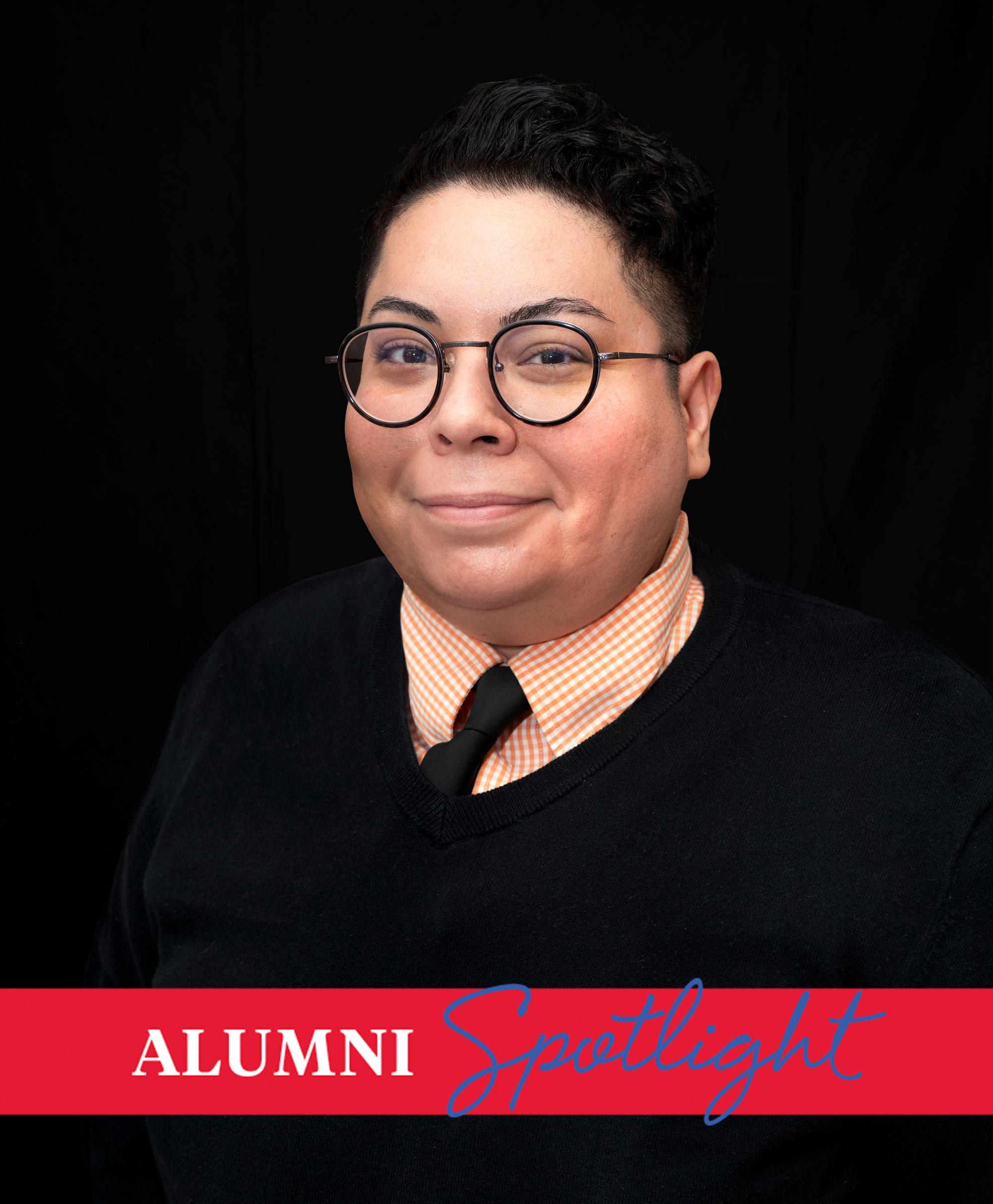 Art history alum Claudia Zapata poses against a black background
