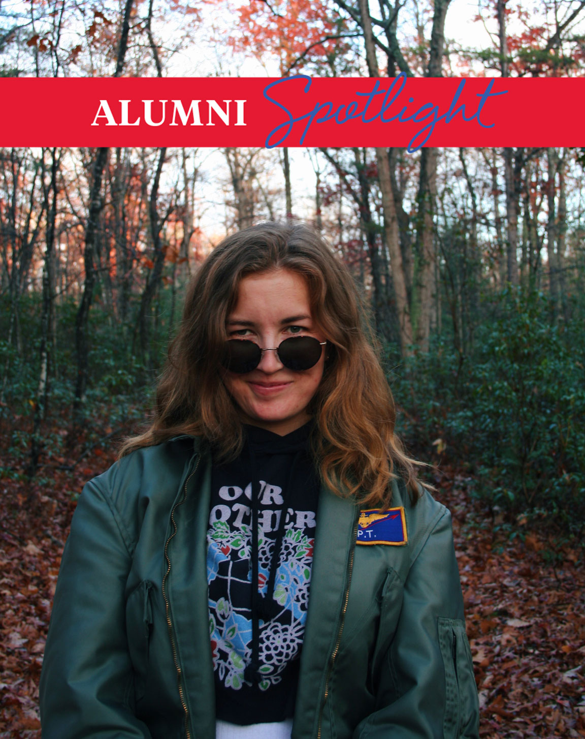 Advertising and CCPA alum Palmer Beldy poses in the woods