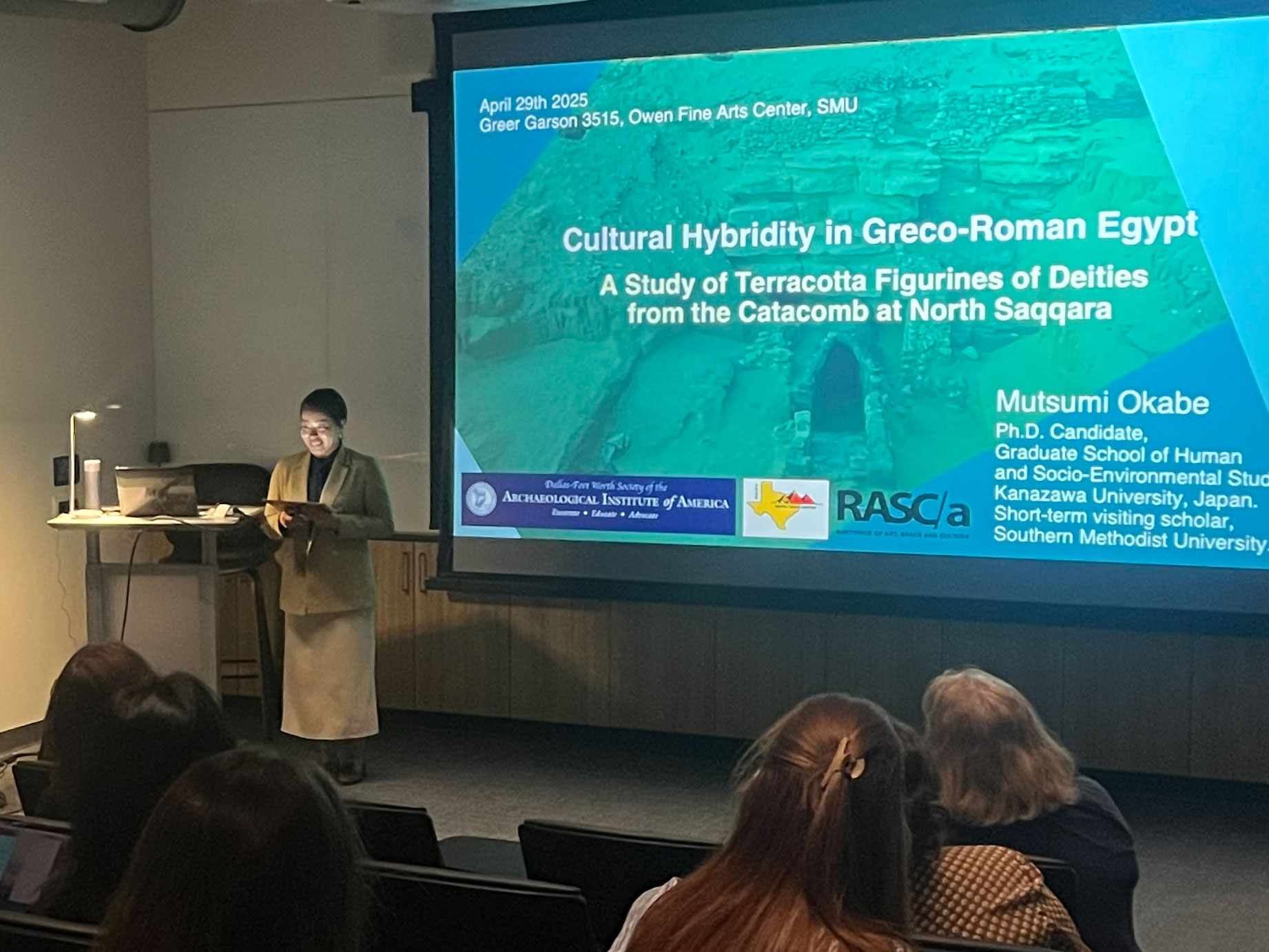 Visiting scholar Mutsumi Okabe presenting her final research presentation to a class.