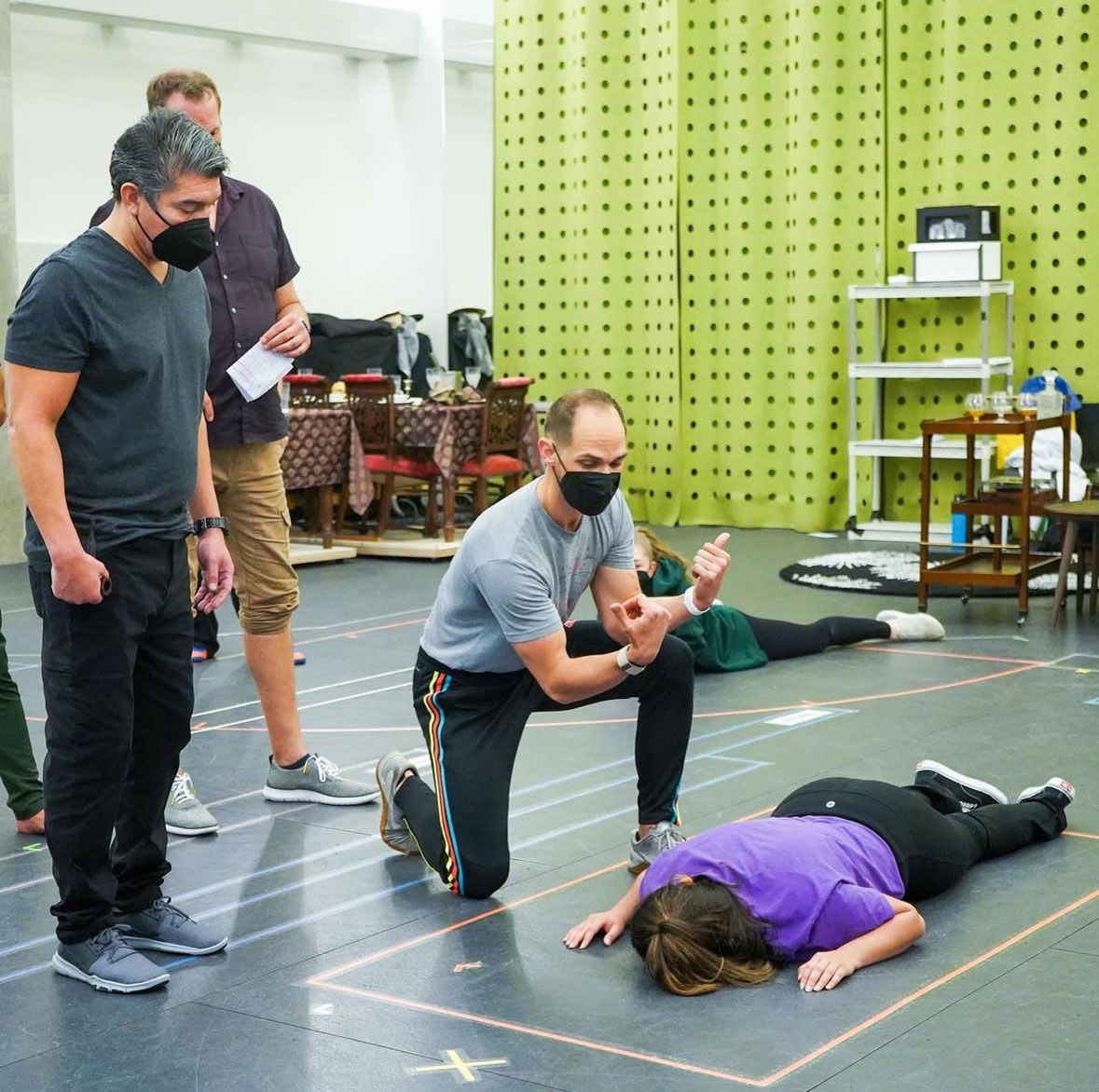 Carter Gill movement directing CLUE with actors at Dallas Theatre Center.