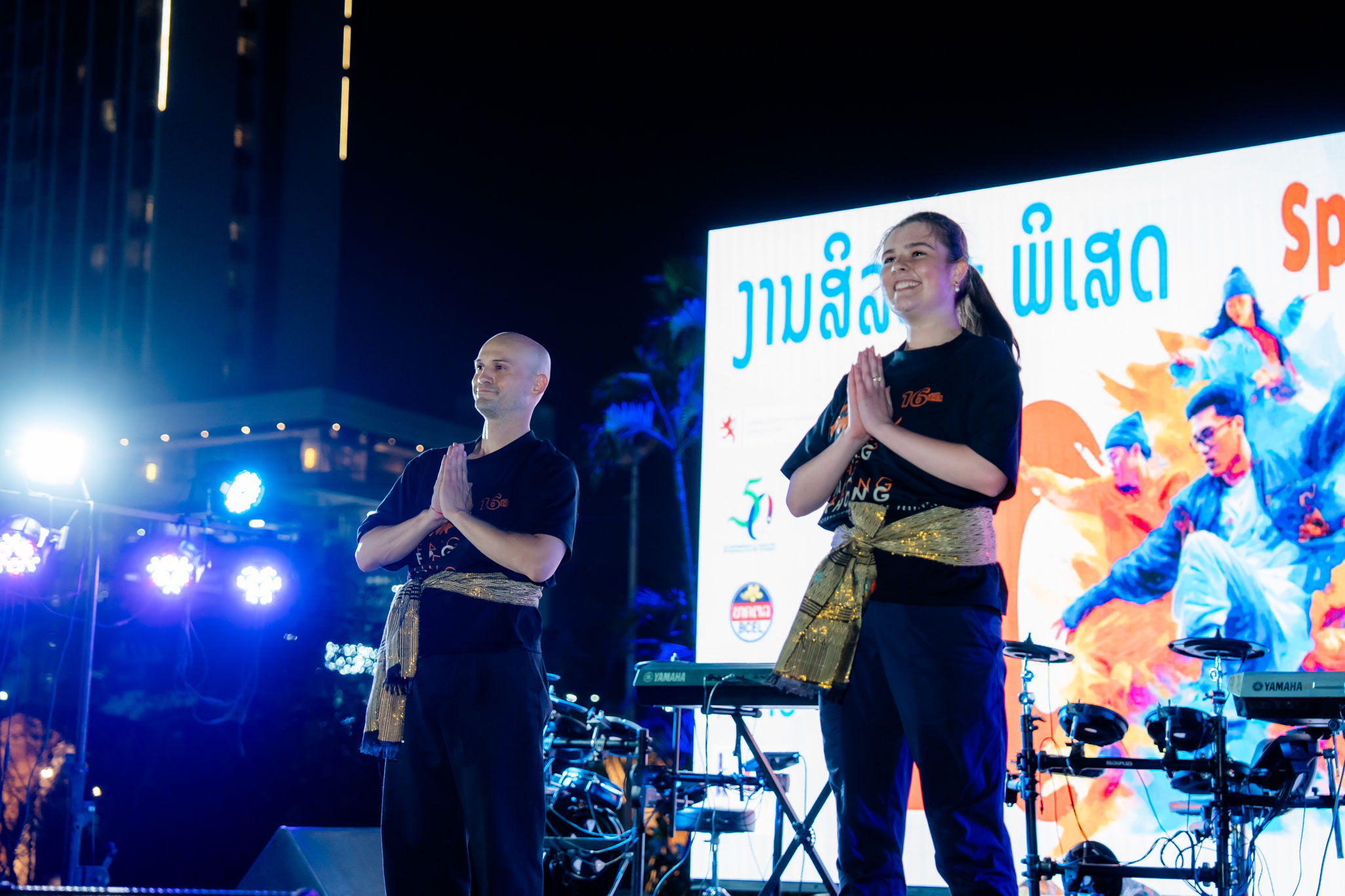 Dance alum Anna Kelley Zielke on stage at a festival in Laos
