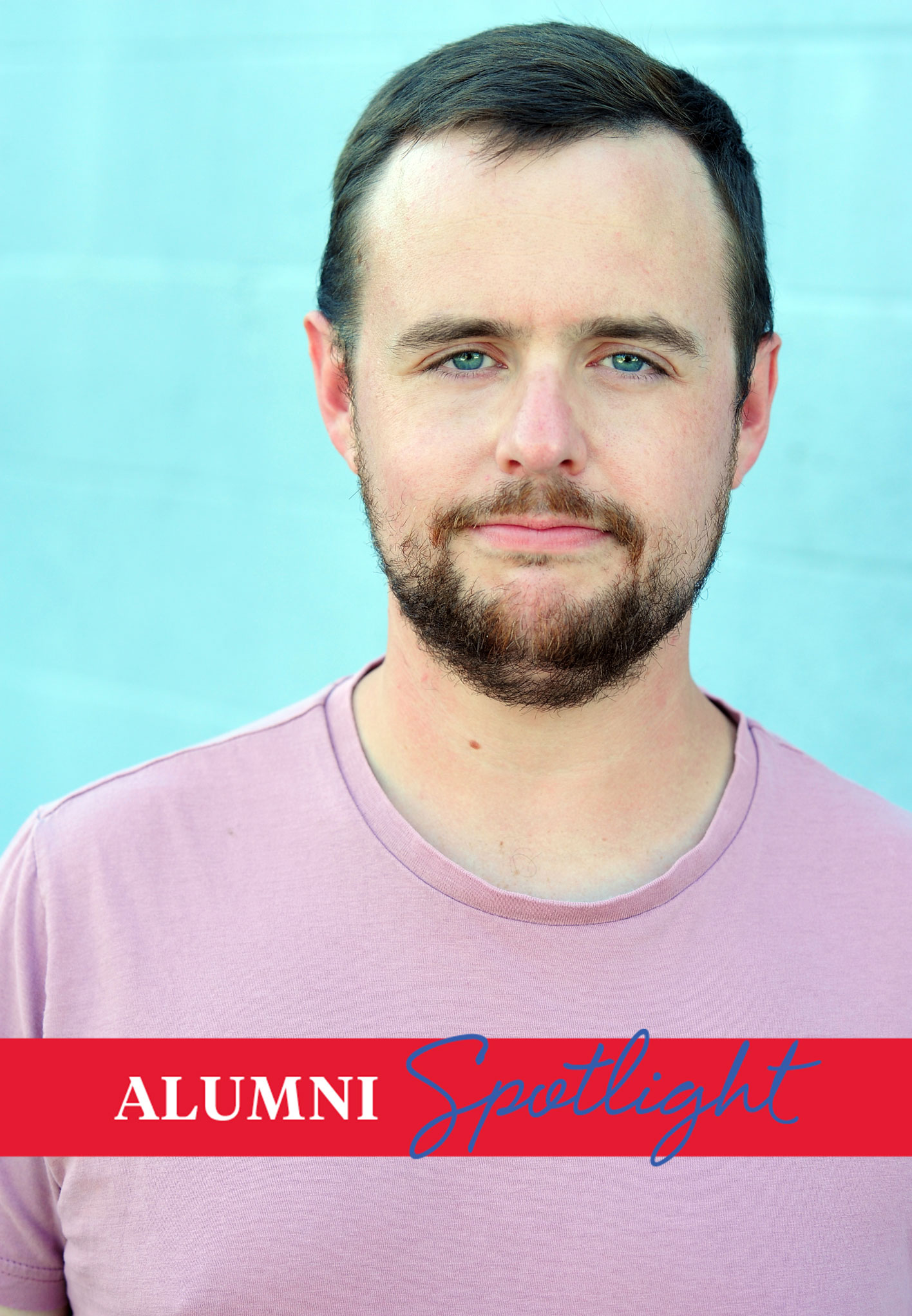 Headshot of theatre alum John Paul Green wearing a pink shirt against a blue background