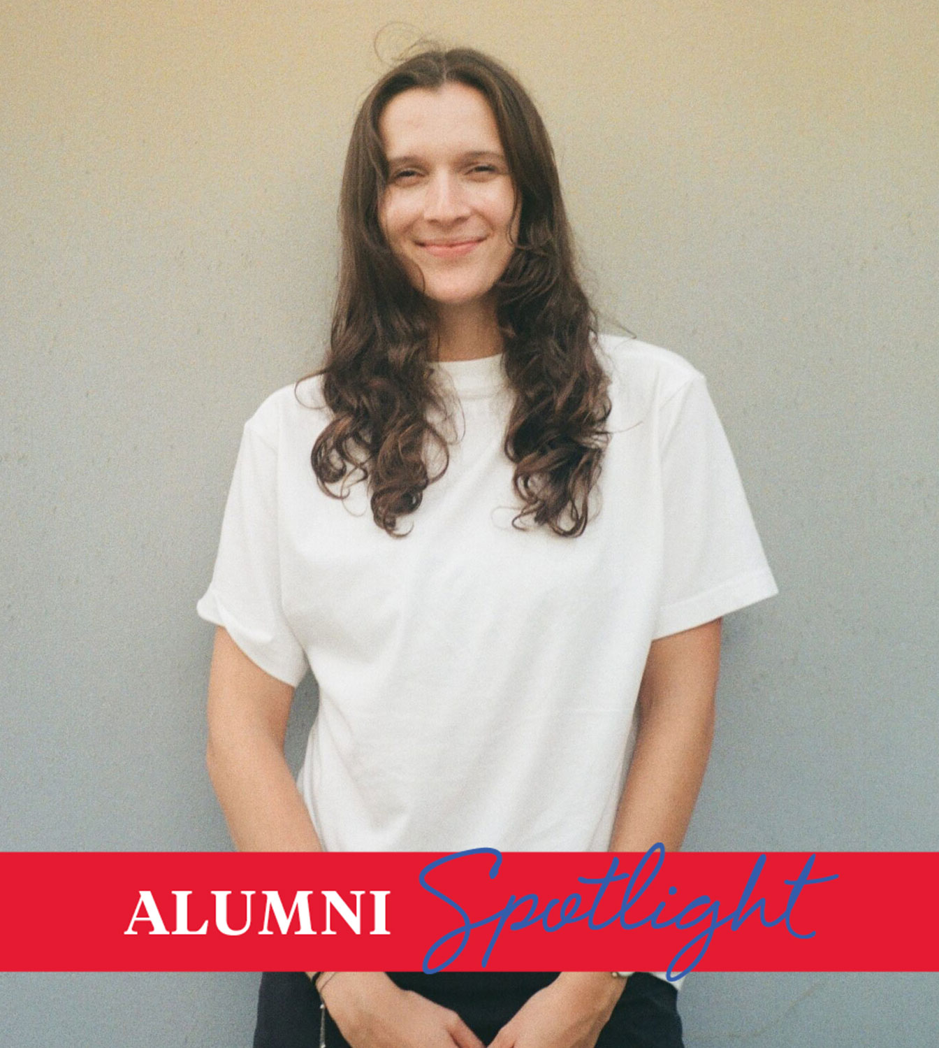 Advertising alum Jolie Guz poses in a white tshirt against a neutral background