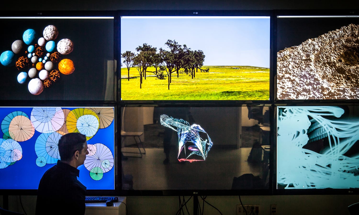 The multi-screen display within SMU Meadows Center of Creative Computation showcases an interdisciplinary project.