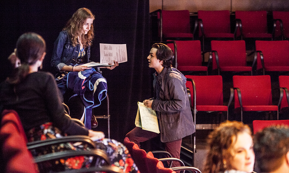 Students in SMU’s Master of Fine Arts in Theatre go over technical notes for a production.