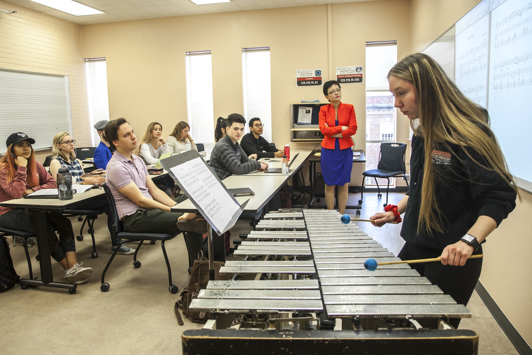 A Bachelor of Arts in Music major demonstrates percussion techniques in front of a class at SMU Meadows School of the Arts.