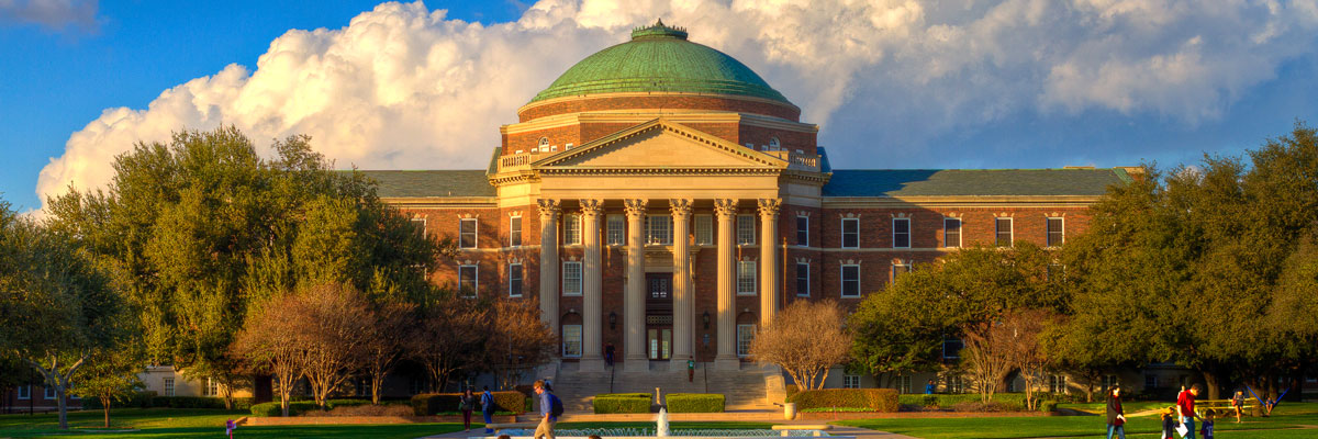 Students enjoying the lovely late afternoon in the quad in front of Dallas Hall at SMU.