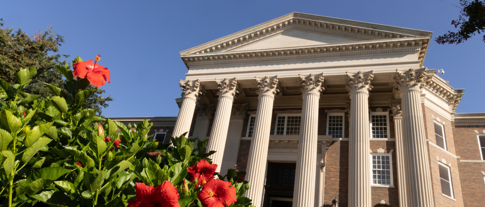 SMU building in spring with flowers
