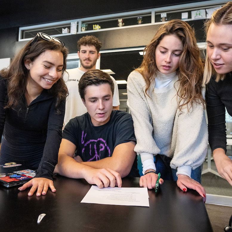 SMU students collaborate in a small-group academic setting during an honors-level learning experience.