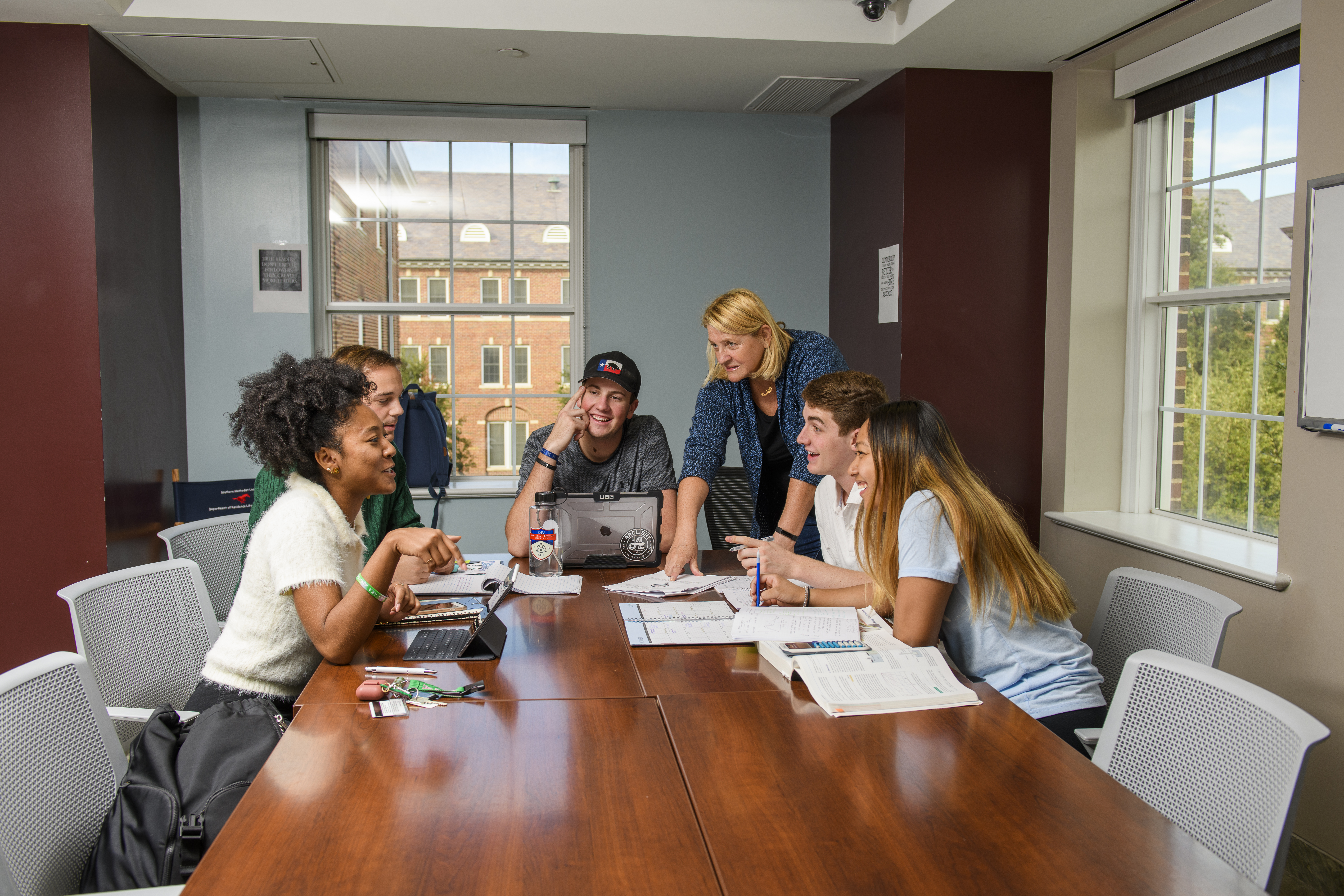 Professor teaching small study session of students