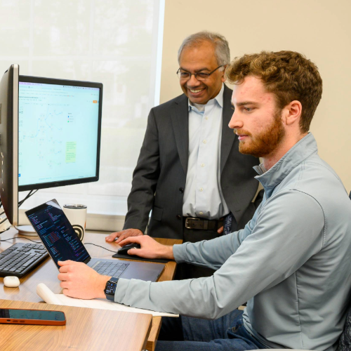 Two Researchers at a Desktop Computer