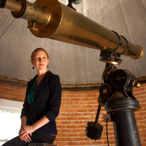 Researcher with telescope