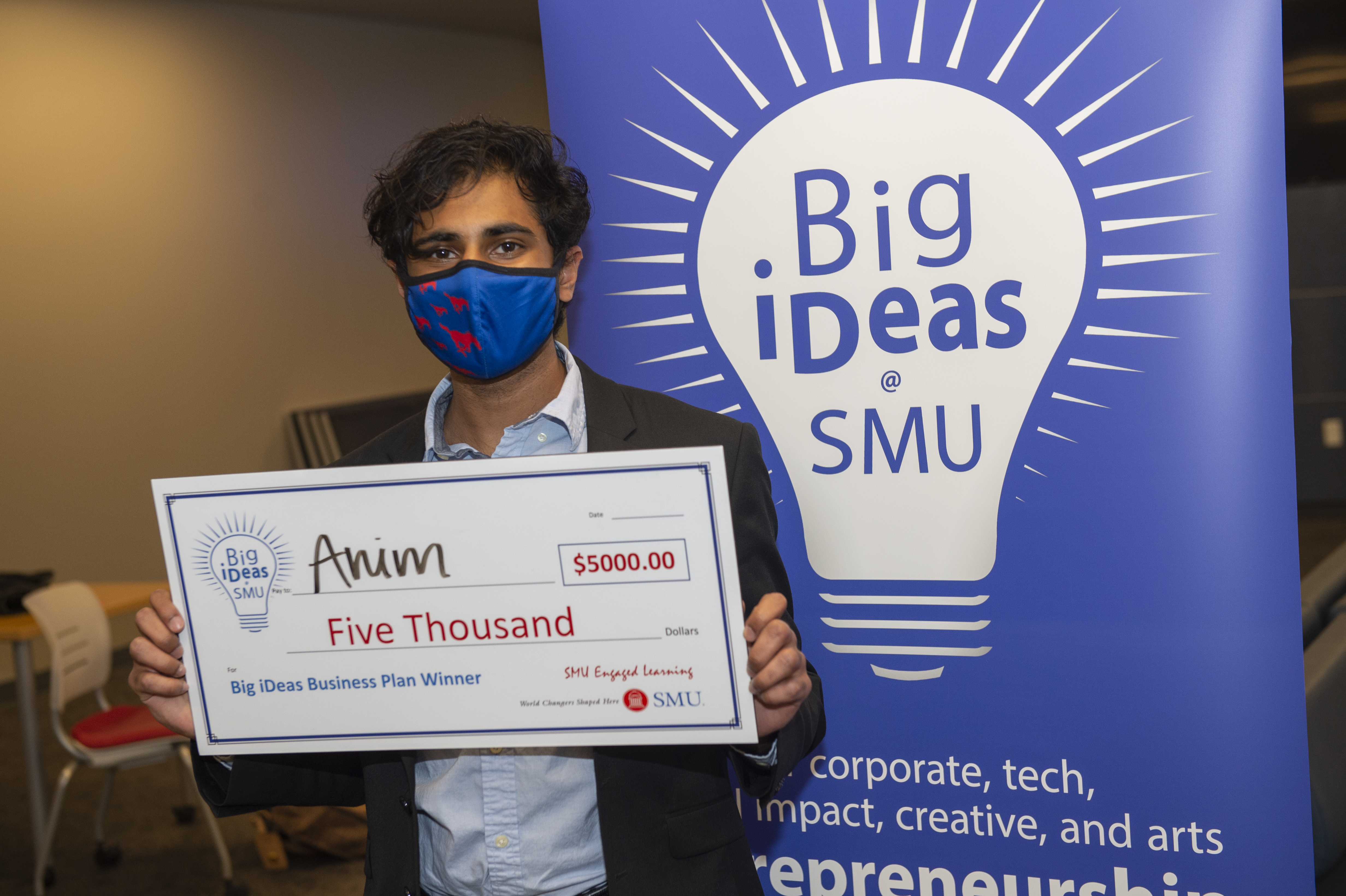 Big ideas winner Maniv Jain with his big check