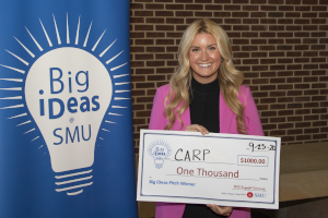 Big ideas winner Olivia Gruber with her big check