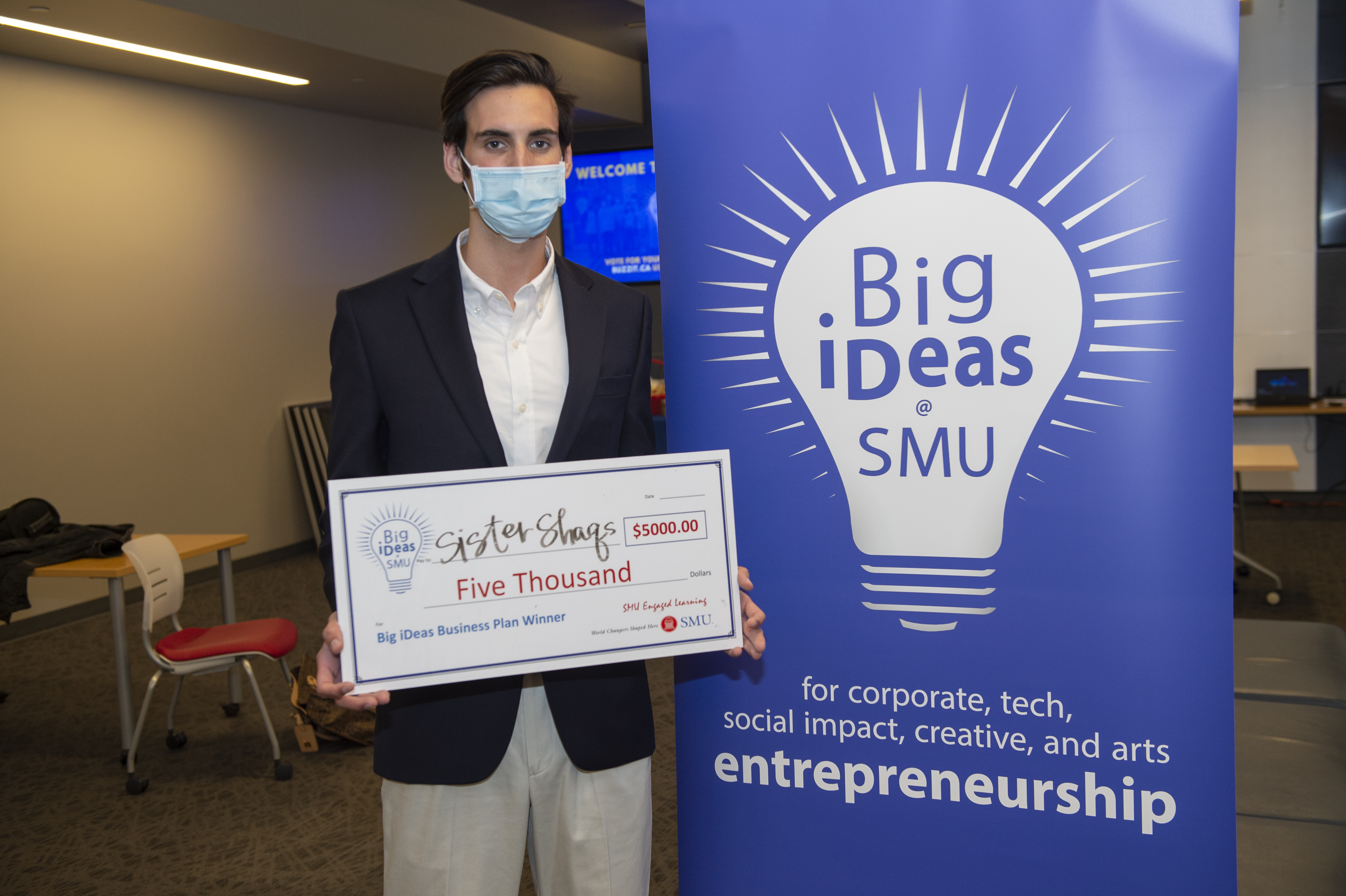 Big ideas winner Raleigh Dewan with his big check