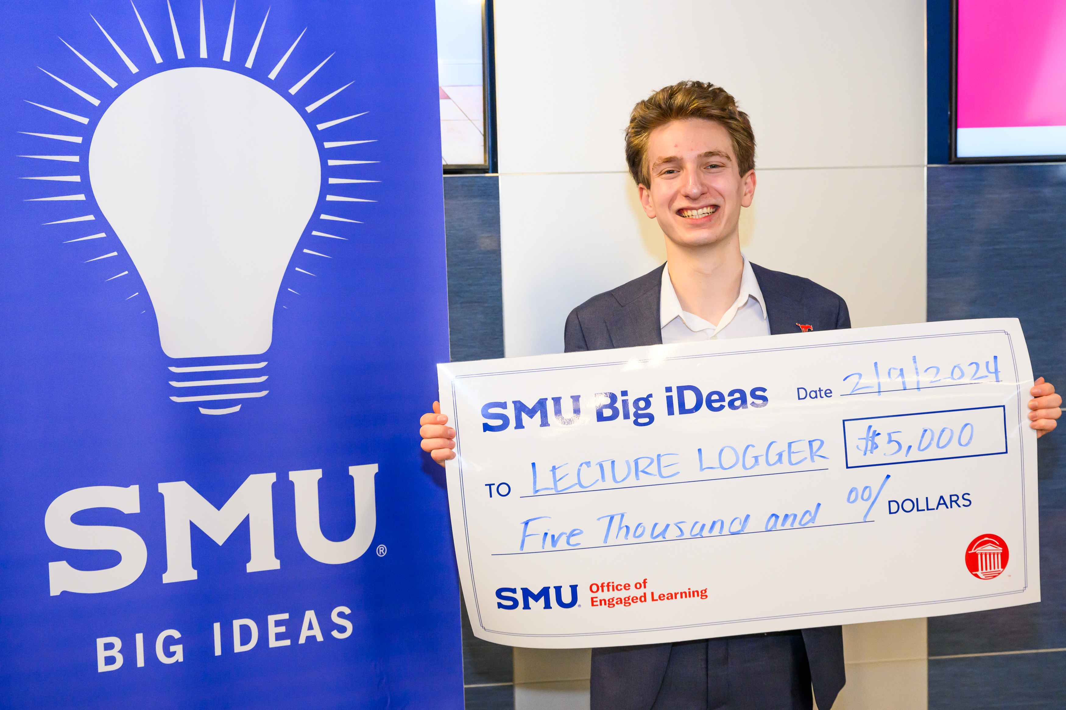 Jude Lugo with his big check from Big iDeas