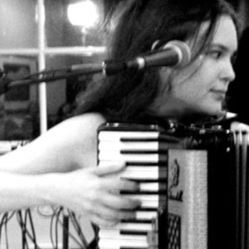 photo of Dr. Courtney Brown playing accordion