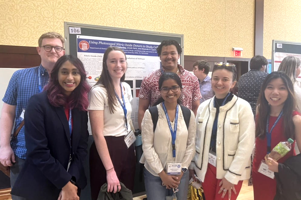 photo of SMU students presenting posters at NCUR conference