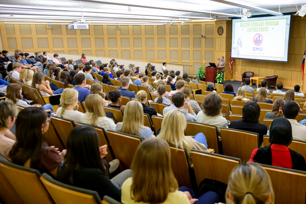 Large lecture hall full of Hilltop Scholars listening to Dr. Johnathan Malesic, a SMU faculty member, speak at a Hilltop Scholars Storytellers Collective Lecture
