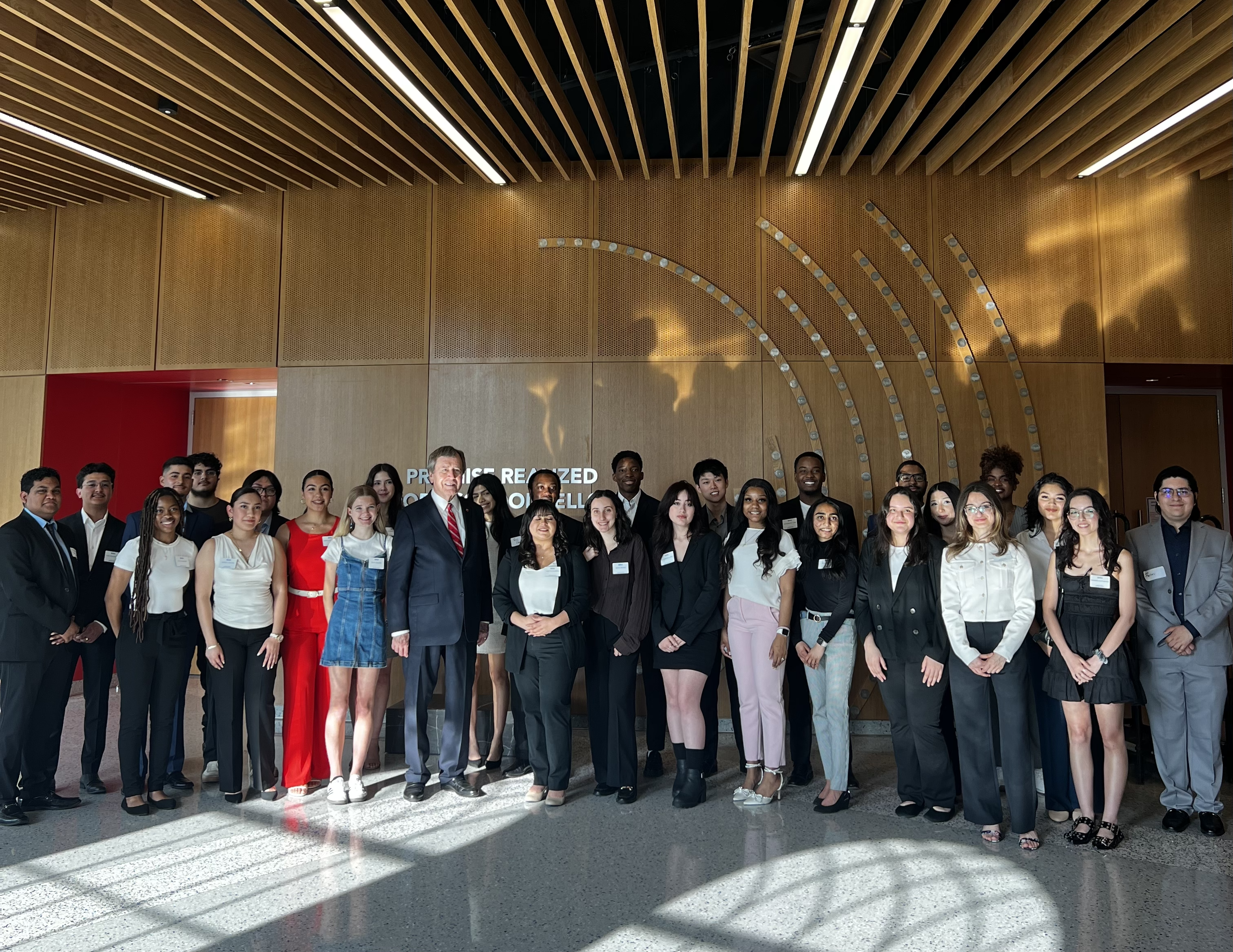 students posing with President Turner