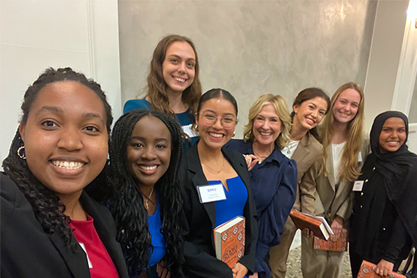A group of female President's Scholars pose with Author Brene Brown, Tate Lecture Series Speaker