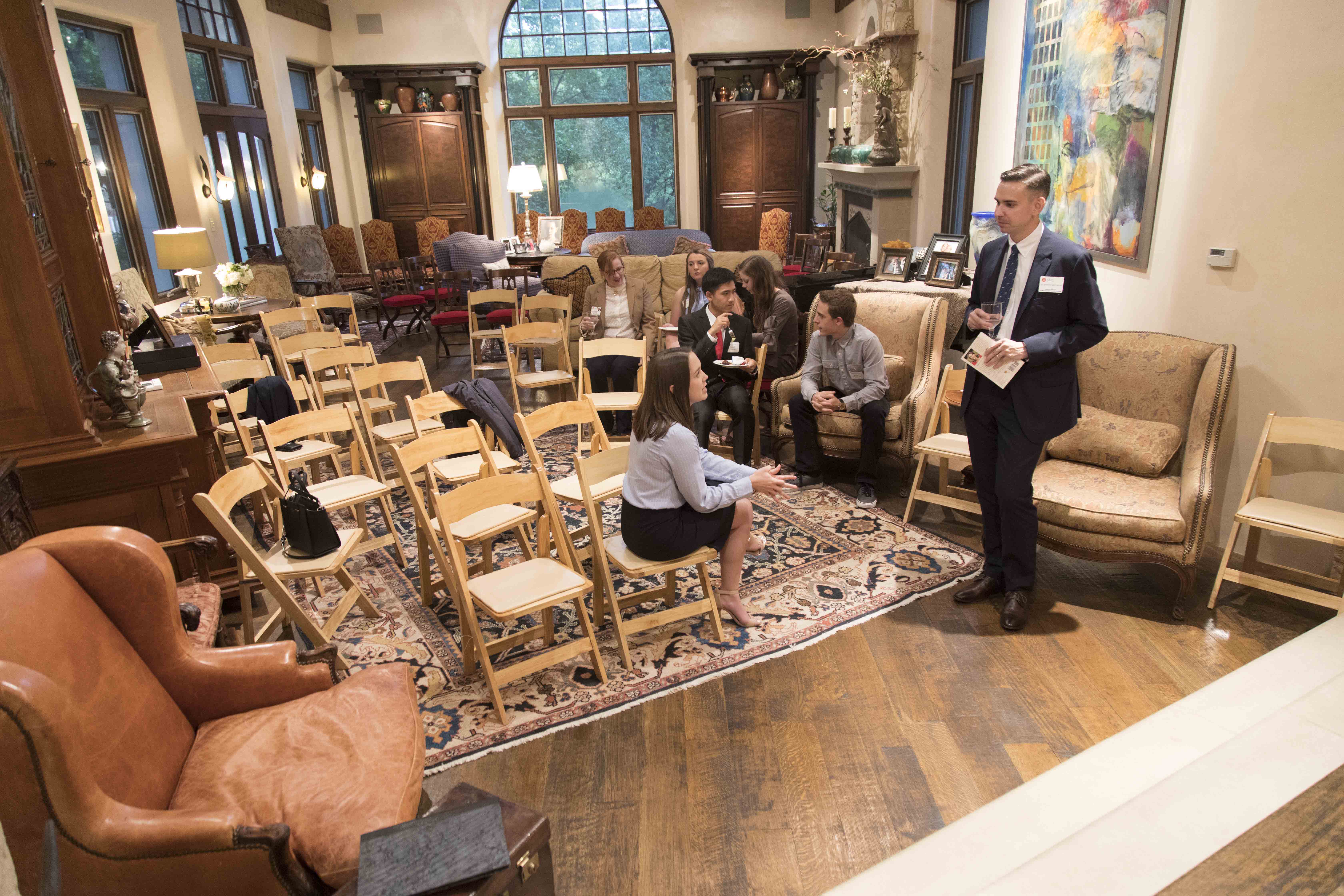 Alumni talk with current students at a mixer event