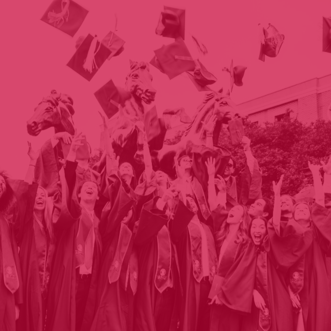 Image of SMU students throwing their graduation caps in the air