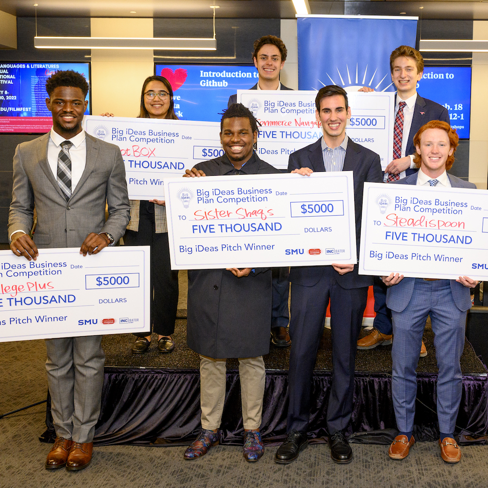 Group photo of Big iDeas winners with big checks
