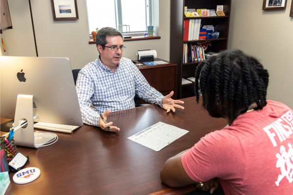 Advisor assisting a student 