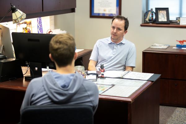 student with faculty