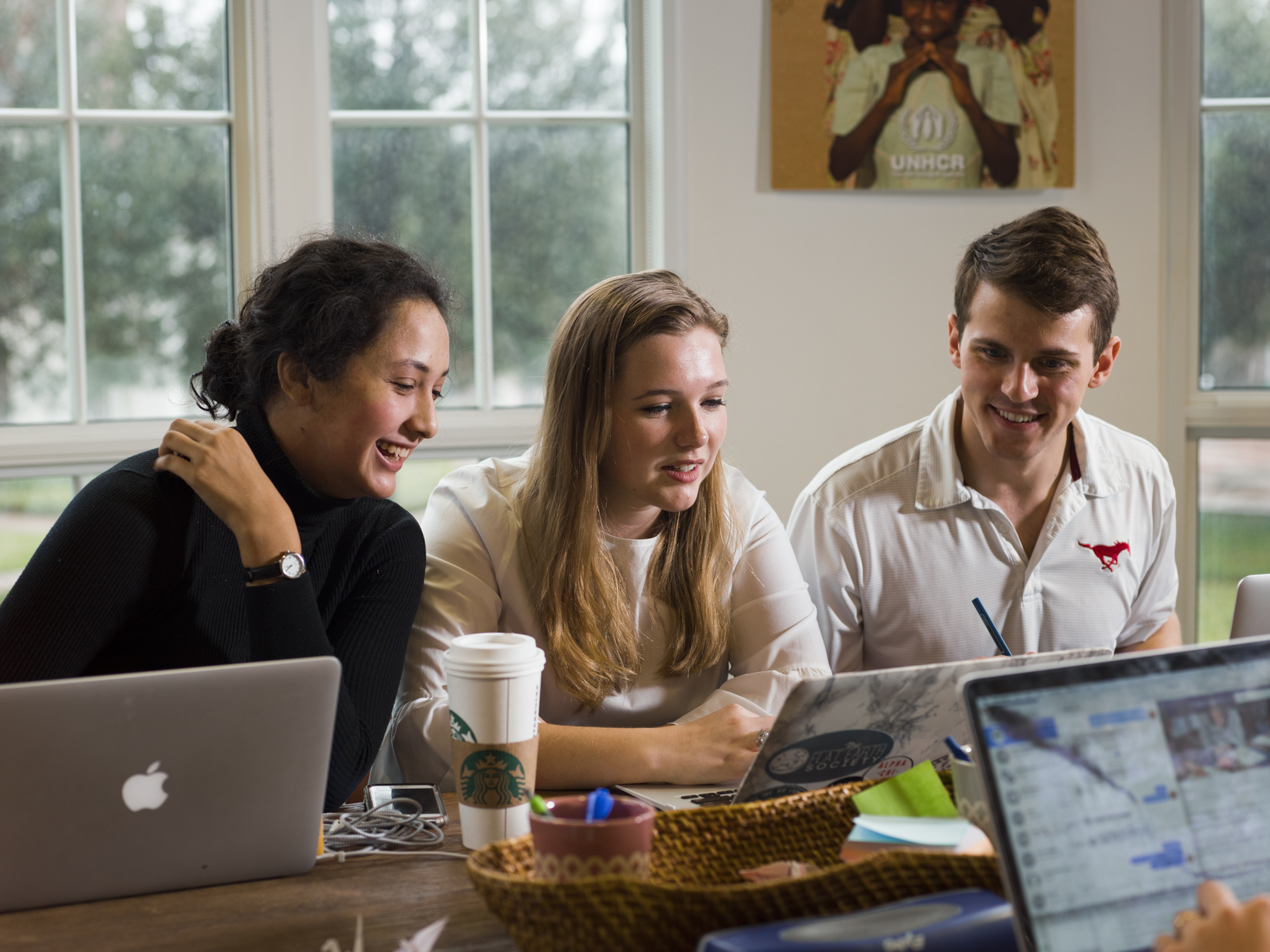 Three students conversing