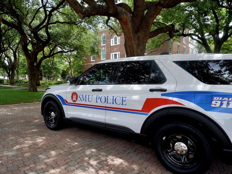 <img alt="image of parked SMU Police vehicle" src="...">