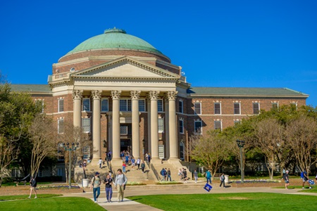 Students walking in front of Dallas Hall.