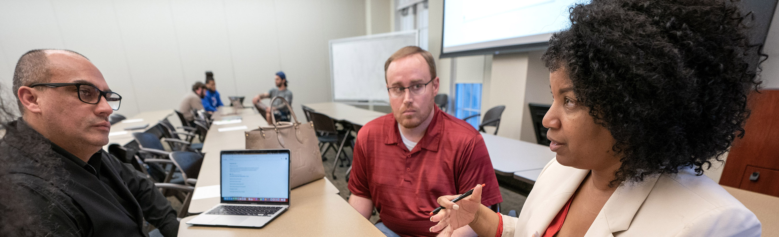 MLS students working together in breakout groups in Harold Clark Simmons Hall.