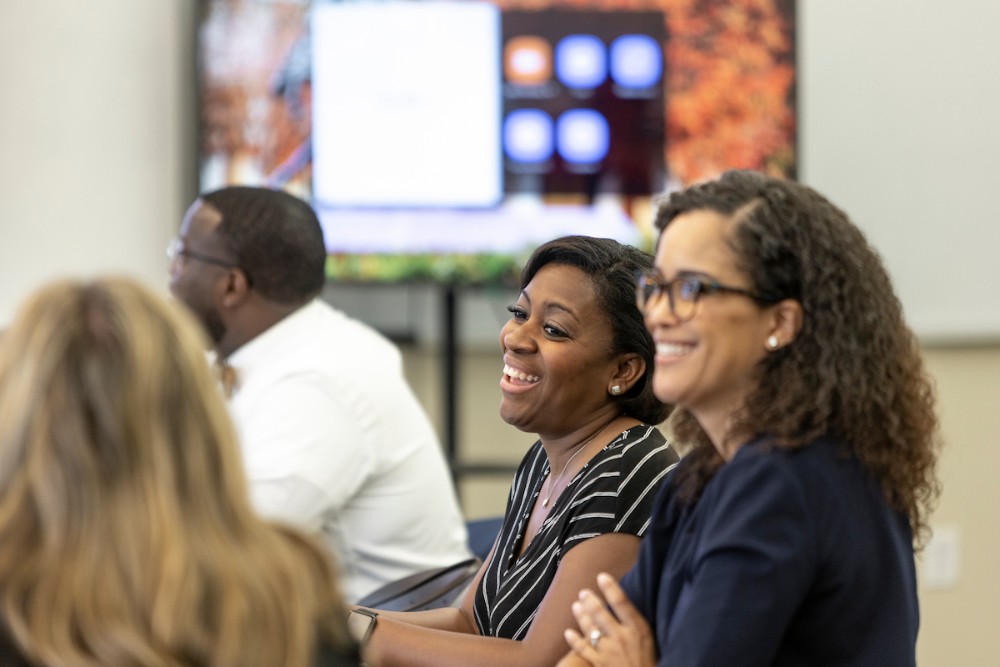 Students engage in the classroom while pursuing a higher education master’s degree at SMU.